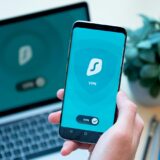 person holding black iphone 4