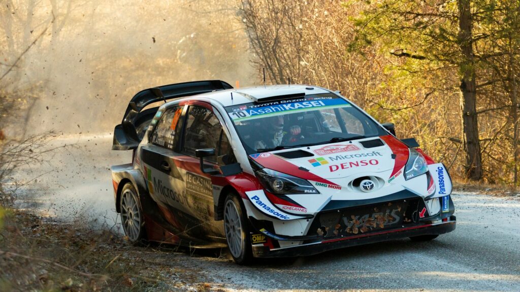 white and red vehicle at road