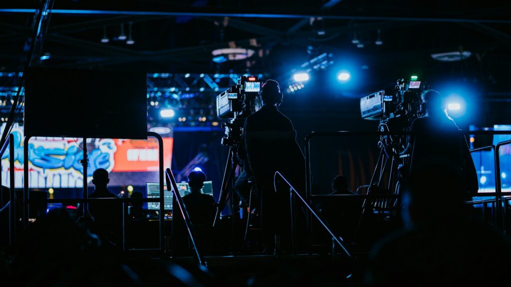a group of people standing in front of a camera