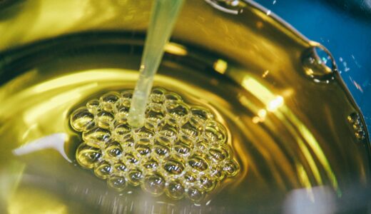 a metal bowl filled with yellow liquid