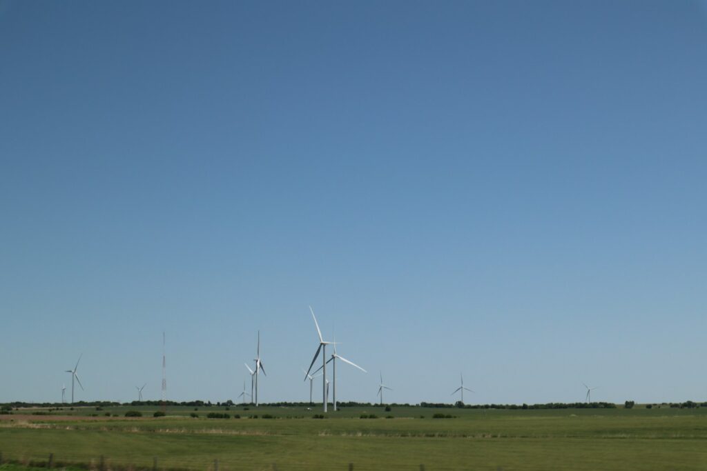 a field with windmills in it